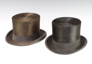 A gentleman's Continental black silk top hat approx. size 7 and 1 other the interior marked 5/57 
