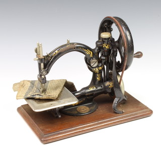 A Wilcox and Gibbs manual sewing machine (no case) 