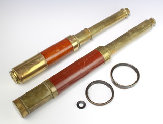 Two 19th Century brass and two draw telescopes (f), together with 2 large lenses 