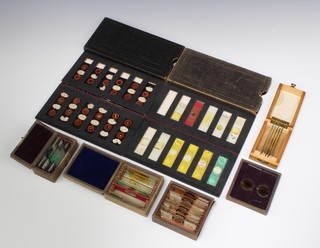 Two folders of 19th Century microscope slides by Ogilvy and Co London containing 23 slides, together with 26 glass microscope slides contained in 4 boxes 1 by J H Steward  