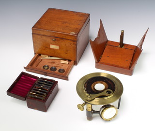 A 19th Century brass dissecting microscope contained in a mahogany case fitted a drawer containing four dissecting instruments and 3 lenses, 9 Warttem M filters contained in a leather box and 1 other 19th Century and mahogany part dissecting microscope  