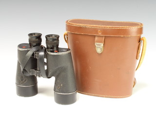 A pair of Rel/Canada military issue binoculars marked Rel/Canada 1944 C.G.B 40 MA 7x50 19995-C, complete with leather carrying case