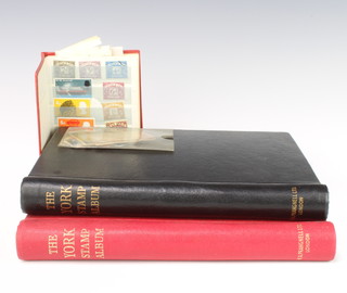 A red York stamp album containing world stamps - USA, Spain, South Africa, Poland, Nigeria, a black ditto - Italy, India, Hungary, GB, Victoria and later, West Germany, France, Australia and a small red stock book of world stamps