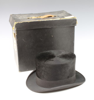 A gentleman's black silk top hat approx. size 7, labelled inside 58, complete with carrying case