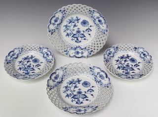 A pair of late 19th Century Meissen pierced blue and white plates decorated with flowers 21cm, a ditto pair 24cm
