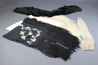A black ostrich feather stole, a mesh & gilt metal stole, an embroidered black silk shawl with deep fringe together with a white silk ditto  