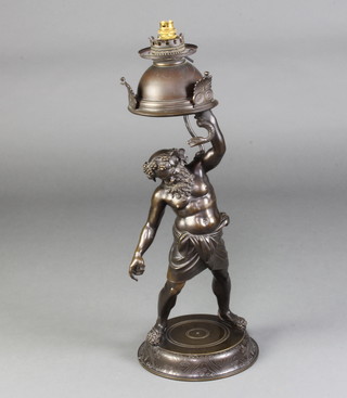 A Victorian bronze oil lamp in the form of a classical gentleman with serpent, raised on a circular base 69cm x 25cm diam. 