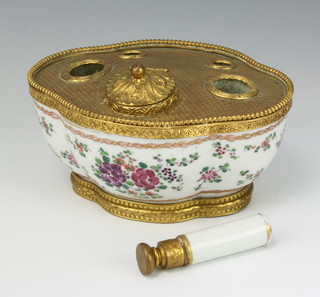 A 19th Century Samson gilt metal mounted inkstand with hinged inkwell and 4 receptacles, the body decorated with flowers together with a gilt metal mounted porcelain seal 14cm 