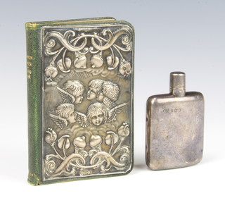 A Victorian silver hip flask 7.5cm 44 grams together with a Reynolds Angels silver mounted Edwardian prayer book Birmingham 1905