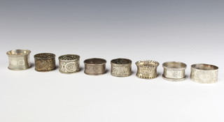 A Victorian silver napkin ring London 1891 and 7 others, 190 grams 

