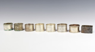 A silver napkin ring London 1933 and  7 others, 283 grams