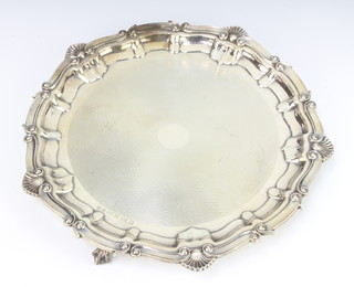 A silver salver with shell rim and engine turned decoration Birmingham 1990 30cm, 791 grams