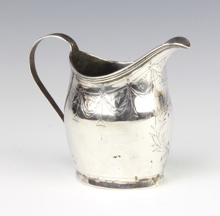 A George III silver cream jug with chased floral decoration and vacant cartouche, London 1801, 88 grams