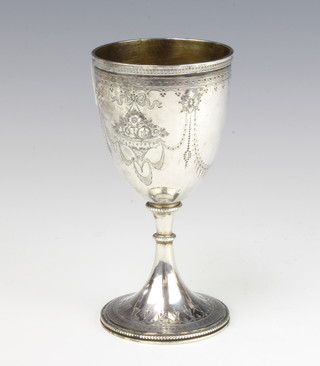 A Victorian silver repousse goblet with baskets of flowers and scrolls, London 1871, 14cm, 133 grams 