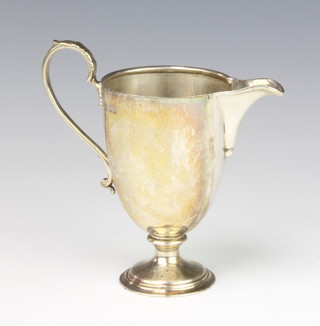 A silver cream jug with S scroll handle, London 1937, 12cm, 121 grams 