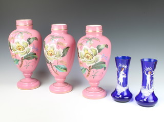 A pair of Victorian pink glass painted vases decorated with flowers 34cm, a matching taller ditto 36cm and a pair of Mary Gregory style blue vases 20cm 