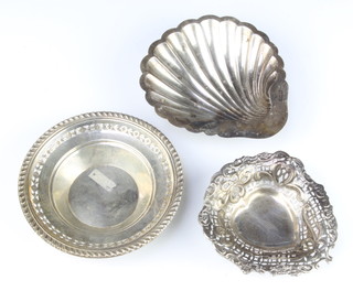 An Edwardian silver repousse and pierced heart shaped bon bon dish London 1900 and two others, 206 grams