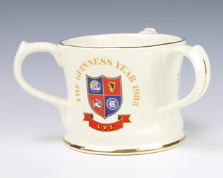A Guinness advertising 3 handled commemorative jug "The Guinness Year 1983" a limited edition of 1200, 11cm 