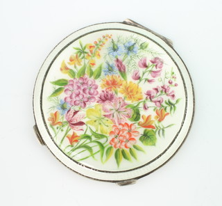 A silver and guilloche enamel circular compact the champagne ground with spring flowers Birmingham 1949, maker HCD 8.5cm 