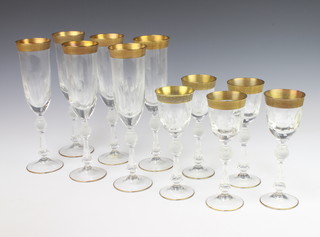 Six champagne flutes with gilt rims and 5 ditto sherry glasses 