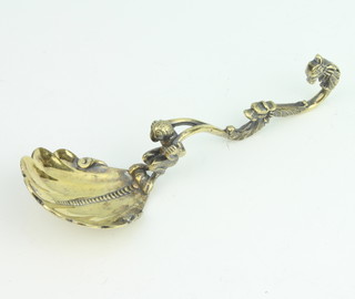 A Victorian silver gilt caddy spoon with shell bowl and figural handle, London 1875, maker John Hunt and Robert Roskell, 46 grams, 12cm 