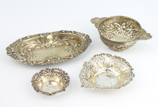 A Victorian repousse and pierced silver heart shaped dish London 1894, 9cm, 2 other dishes and a pierced strainer, 131 grams  