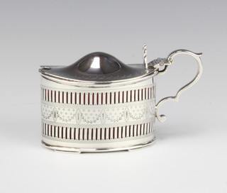A Victorian oval pierced silver mustard pot Sheffield 1888, 11cm, with cranberry glass liner (cracked), 100 grams