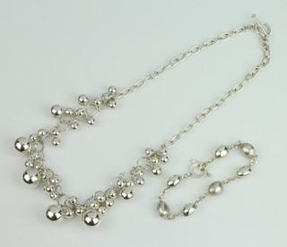 A modern silver ball necklace and a similar bracelet, 98 grams
