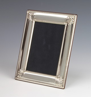 A 925 standard repousse silver rectangular photograph frame 18cm x 14cm 