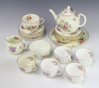 A Royal Worcester Roanoke tea set comprising teapot, milk jug, sugar bowl, large tea cup with saucer, 1 small saucer, 5 small plates and a sandwich plate together with 5 similar tea cups, 4 saucers 