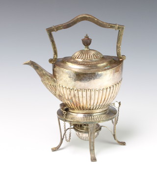 A silver plated tea kettle on stand with burner 