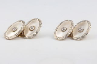 A pair of 18ct yellow gold diamond and mother of pearl cufflinks, the 4 diamonds each 0.10ct 