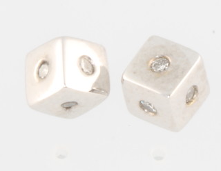 A pair of 18ct white gold diamond set square ear studs 
