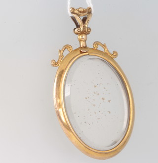 A 9ct yellow gold oval double sided locket 54cm 