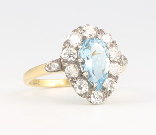 An 18ct yellow gold pear cut aquamarine and diamond ring, the centre stone approx 1.25ct surrounded by 10 brilliant cut diamonds each 0.10ct, size P 
