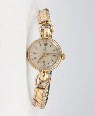 A lady's 9ct yellow gold Tudor Royal wristwatch with seconds at 6 o'clock on an expanding bracelet 