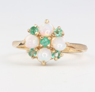 A 9ct yellow gold opal and emerald cluster ring size N 