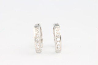 A pair of white gold diamond set hoop earrings 