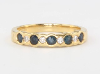 An 18ct yellow gold sapphire and diamond ring size N 3.7 grams