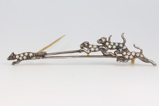 A silver gilt diamond and opal brooch in the form of a fox and 3 hounds 64mm