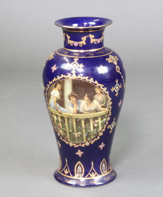 A Royal Limoges garter blue glazed vase with panel decorated ladies on a balcony 36cm x 19cm 