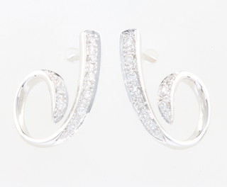 A pair of 18ct white gold diamond scroll ear studs 