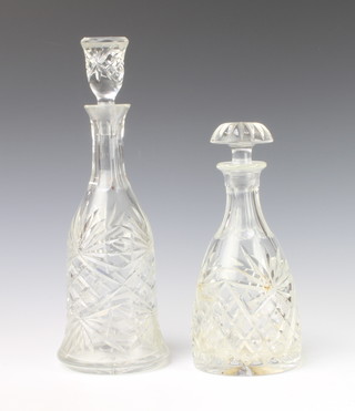 A cut glass mallet shaped decanter with mushroom stopper 25cm, a bell shaped ditto 29cm 