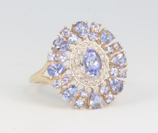 A 9ct yellow gold tanzanite and diamond cluster ring size O 1/2