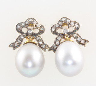 A pair of silver gilt pearl and diamond earrings 20mm 