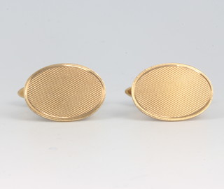 A pair of 9ct yellow gold engine turned cufflinks, 9.1 grams