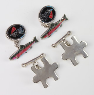 A pair of silver and enamel fishing cufflinks and a pair of silver puzzle cufflinks 