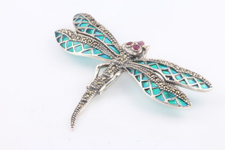 A silver enamel and ruby dragonfly pendant brooch 58mm