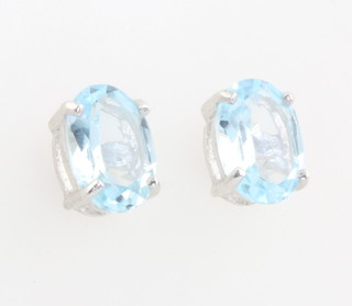 A pair of silver blue topaz ear studs