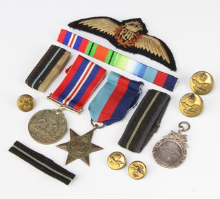 A silver fob medal, a 1939-45 War medal and minor badges 